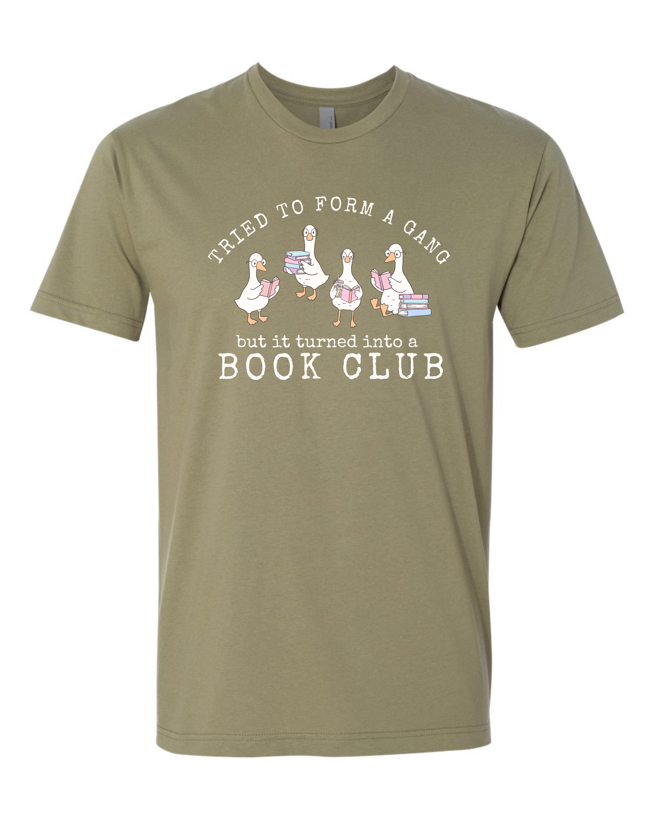 A light olive green short-sleeve crewneck t-shirt featuring a white graphic print of four cartoon geese holding books with the text 'TRIED TO FORM A GANG but it turned into a BOOK CLUB'.