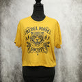 Yellow t-shirt with black graphic design on a mannequin against a gray background