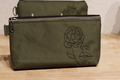 Face with flower bag
